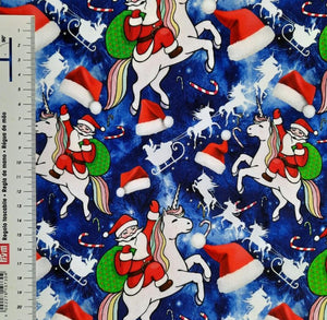 #367 le père noël sur la licorne vendu au demi mètre Coton Lycra surplus