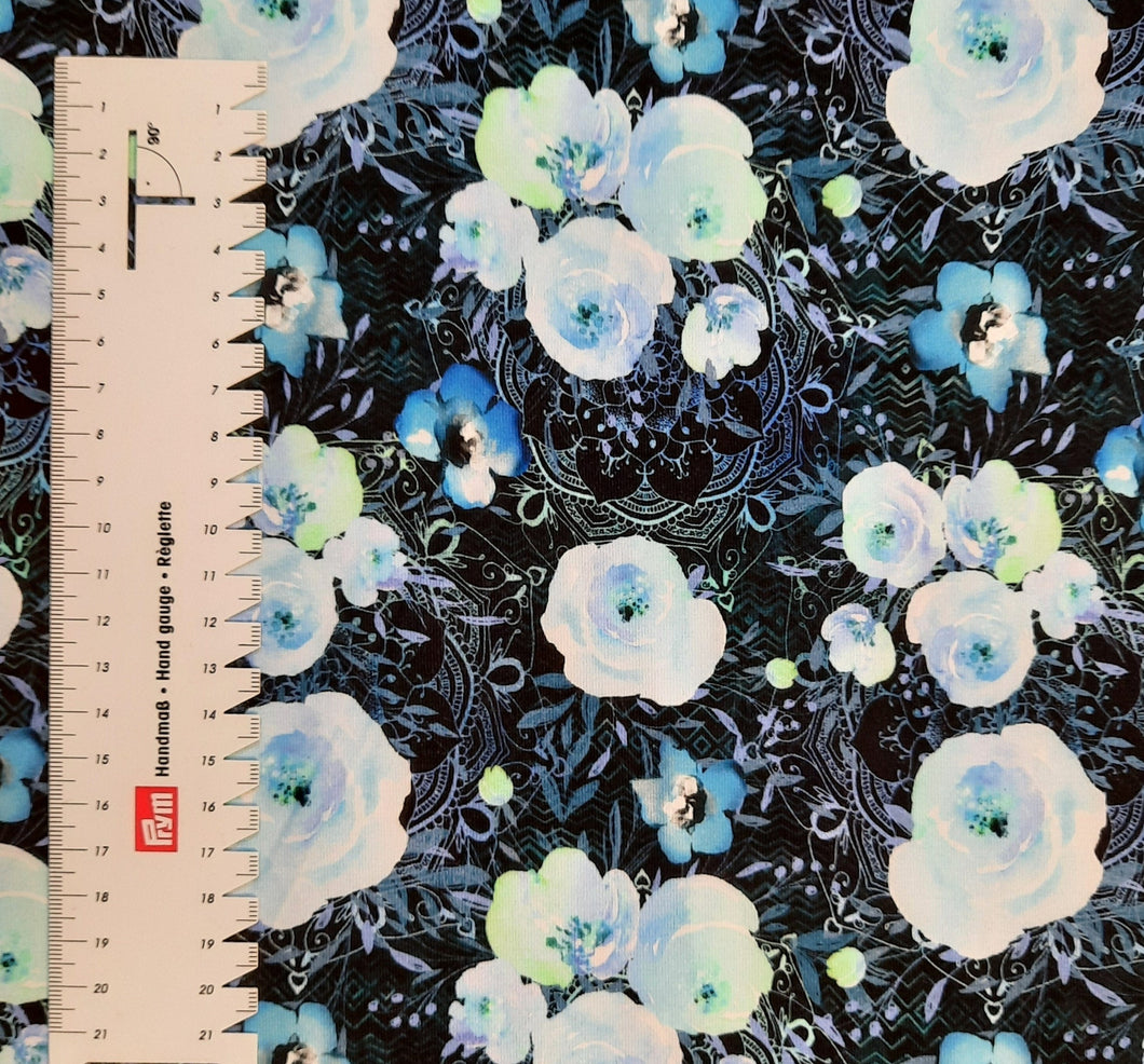 #112 fleurs et mandala vendu au demi mètre Coton Lycra surplus